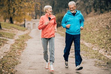 Image of a couple jogging in a garden