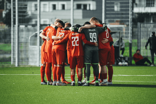 Soccer team standing in a circle